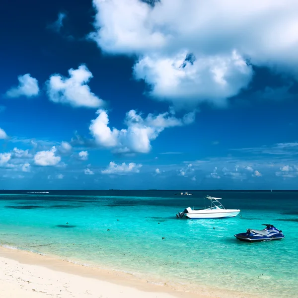 Beach with motor boat — Stock Photo, Image