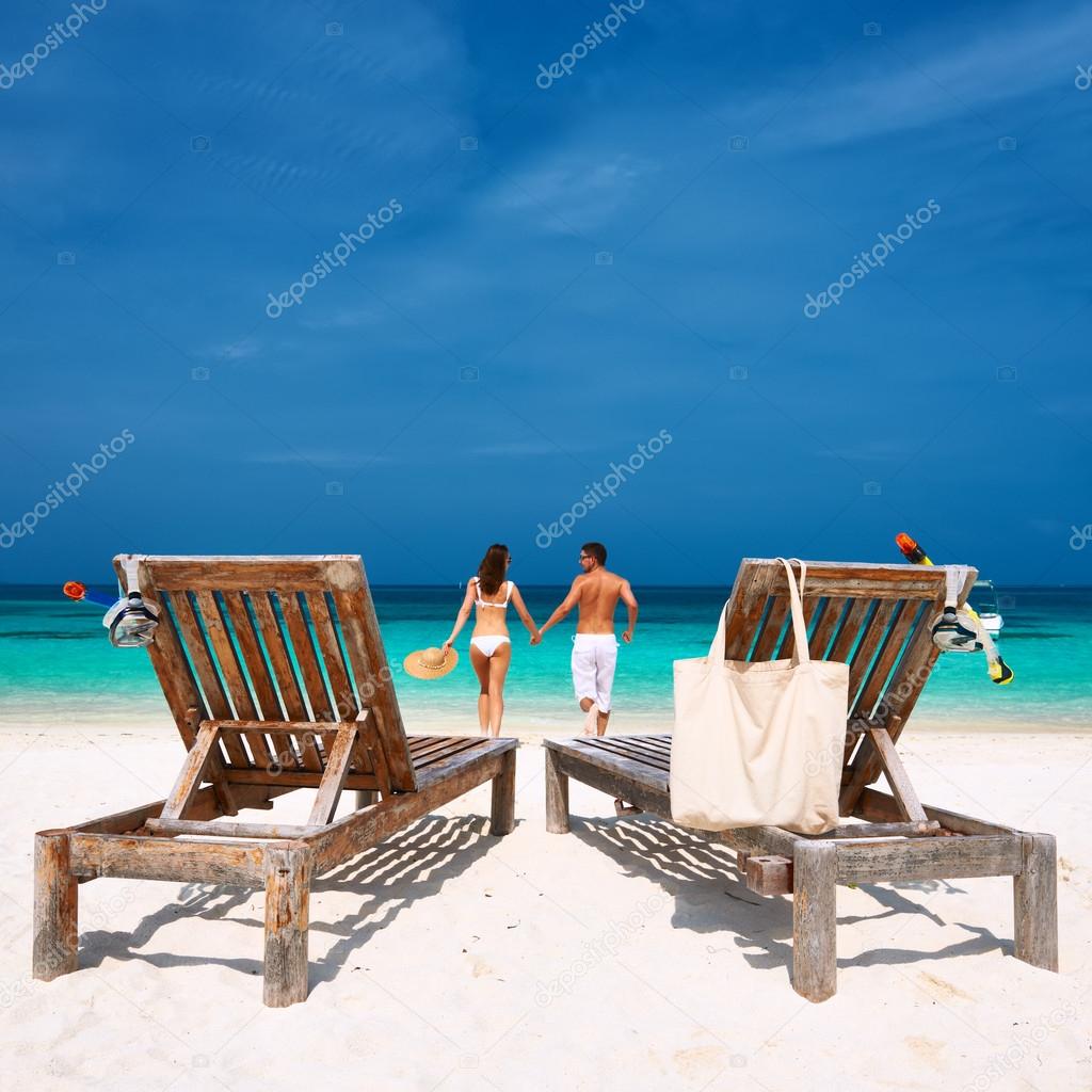 Couple running on beach