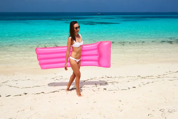 Woman with pink inflatable raft — Stock Photo, Image