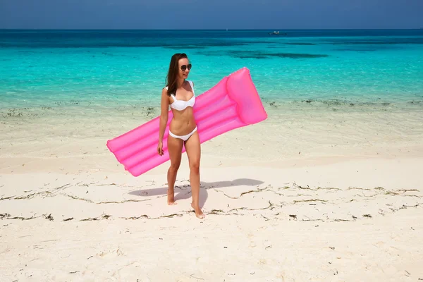 Woman with inflatable raft — Stockfoto