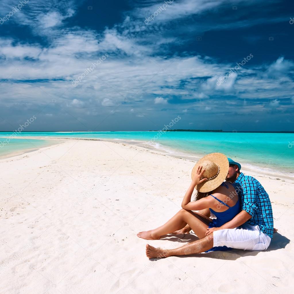 Couple in blue on a beach at Maldives