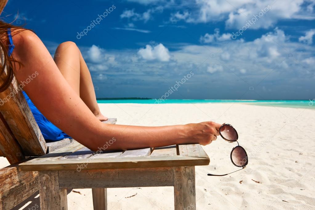 Woman at beach with sunglasses
