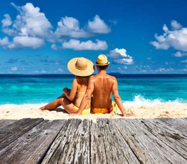 Couple on a beach at Seychelles clipart