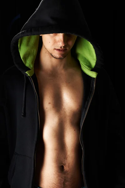 Muscular man in hoodie — Stock Photo, Image