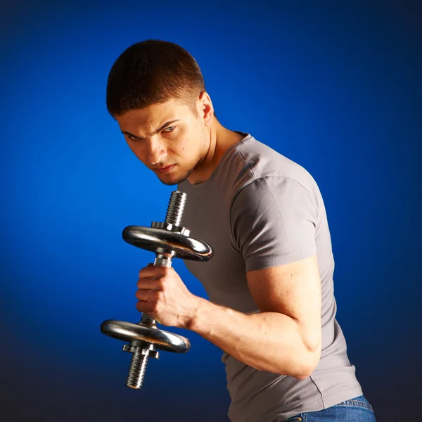 Man working out with dumbbell — Stock Photo, Image