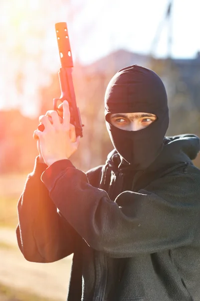Gunman in black mask — Stock Photo, Image