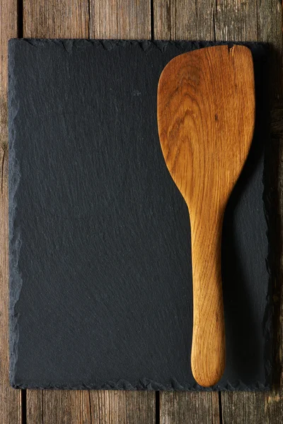 Slate üzerinde tahta spatula