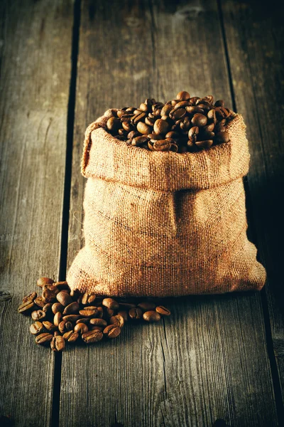 Coffee beans in sack — Stock Photo, Image