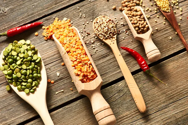 Spoons of various legumes — Stock Photo, Image