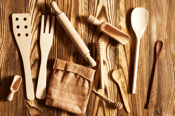 Wooden utensils on rustic background — Stock Photo, Image