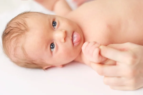 Newborn baby massage Stock Picture