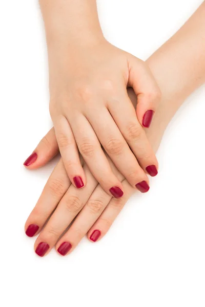 有红指甲的妇女手被白色隔离 — 图库照片