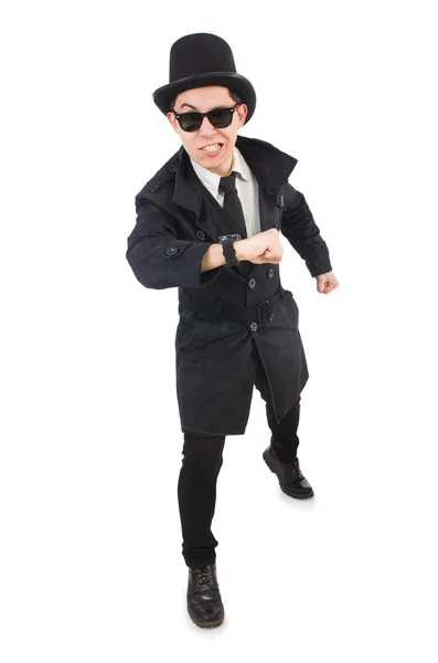 Jovem detetive em casaco preto isolado em branco — Fotografia de Stock