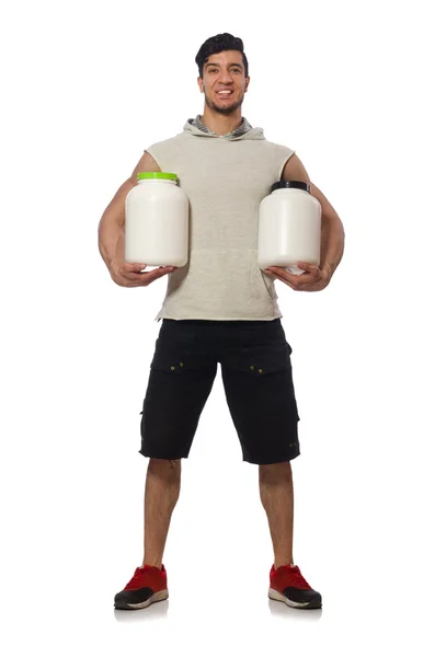 Hombre muscular con frascos de proteínas en blanco —  Fotos de Stock