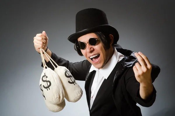 Funny man with dollar sacks — Stock Photo, Image