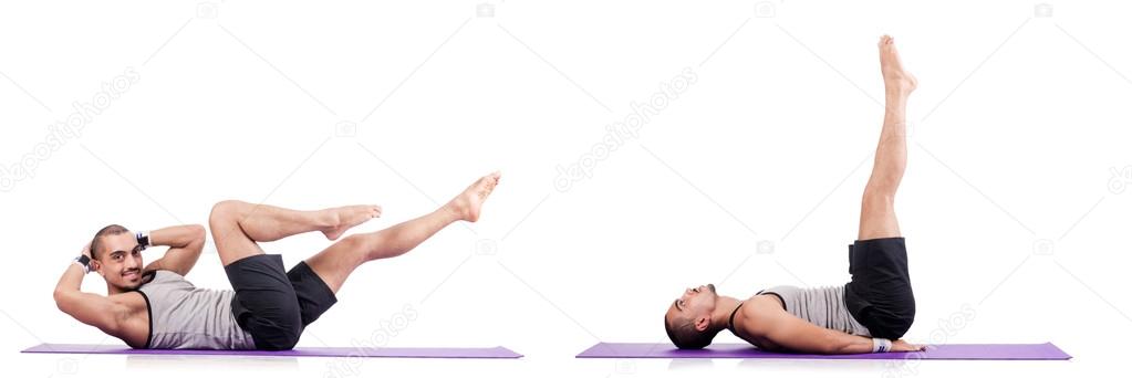 Man doing exercises on white