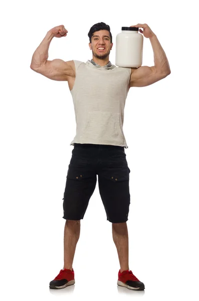 Мускулистый человек с белковыми банками на белом — стоковое фото