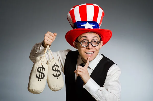 Homem com sacos de dinheiro dólar — Fotografia de Stock