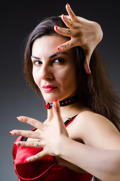 Woman dancing dances in red dress — Stock Photo, Image