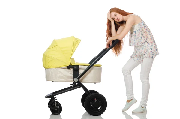 Woman with baby and pram isolated on white — Stock Photo, Image