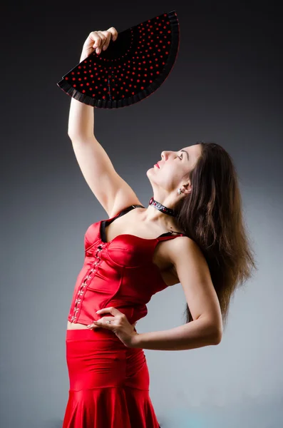 Woman with fan dancing dances — Stock Photo, Image