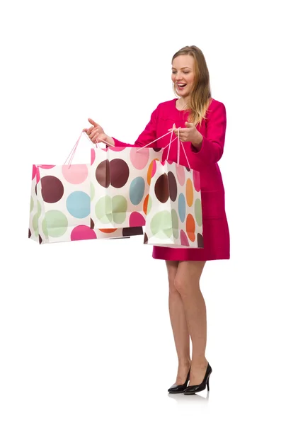 Shopper flicka i rosa klänning holding plastpåsar — Stockfoto