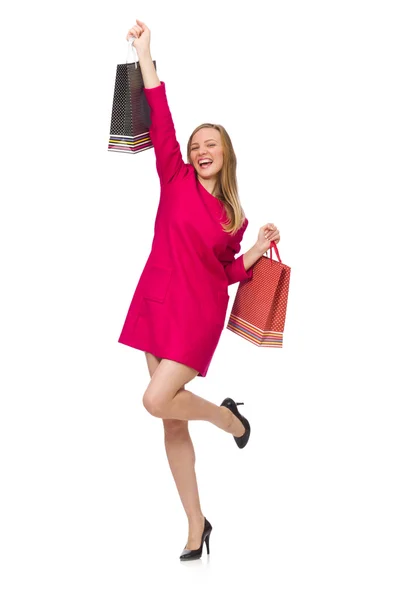 在粉红色的连衣裙，拿着塑料袋购物女孩 — 图库照片