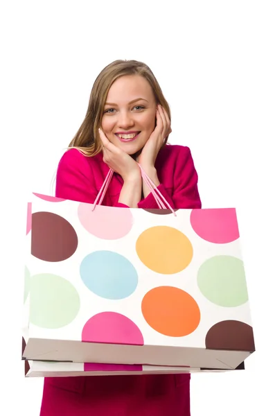 Shopper chica en vestido rosa sosteniendo bolsas de plástico — Foto de Stock