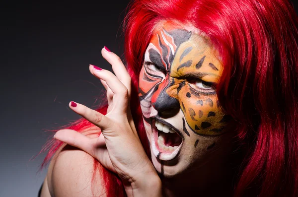 Woman with tiger face in halloween concept — Stock Photo, Image