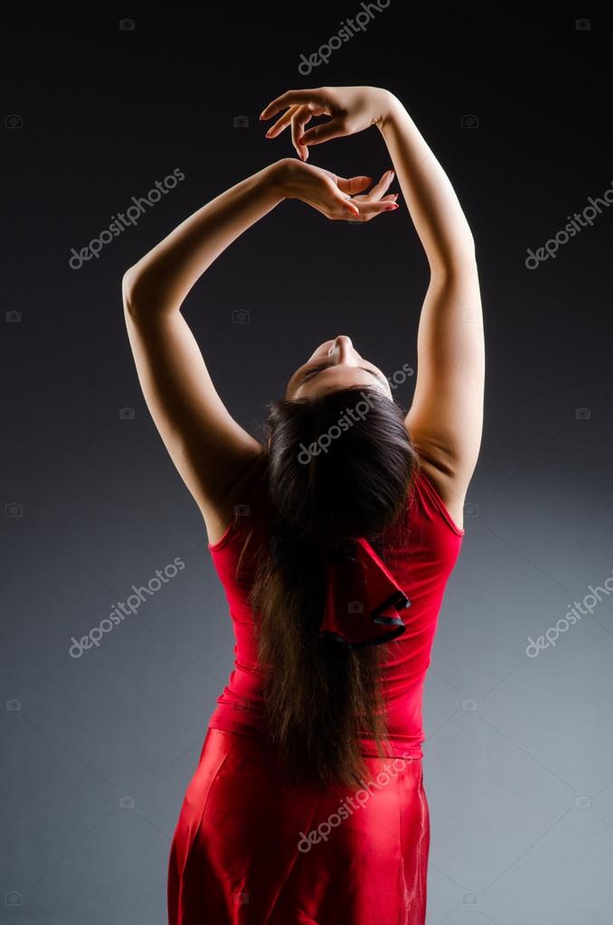 Woman dancing dances in red dress — Stock Photo © Elnur_ #103533858