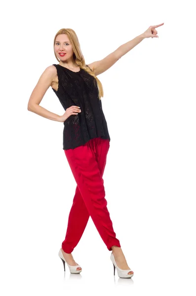Hohe junge Frau in roter Hose isoliert auf weißem Grund — Stockfoto