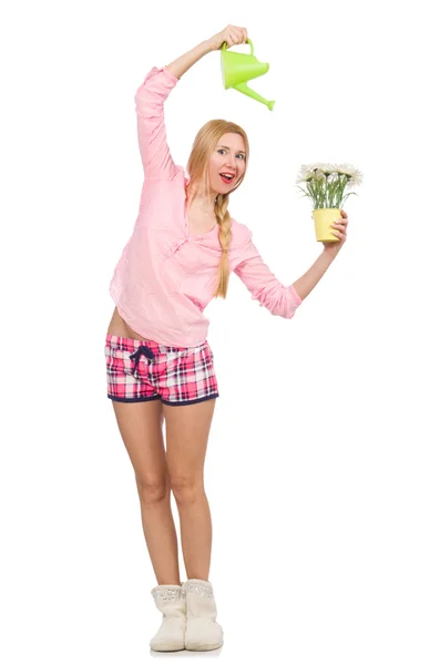 Pretty girl watering the flowers isolated on white — Stock Photo, Image