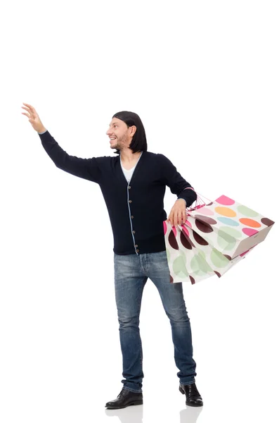 Joven sosteniendo bolsas de plástico aisladas en blanco —  Fotos de Stock