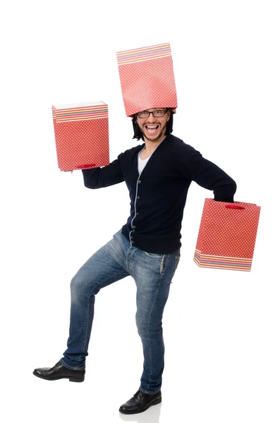 Young man holding plastic bags isolated on white — Stock Photo, Image