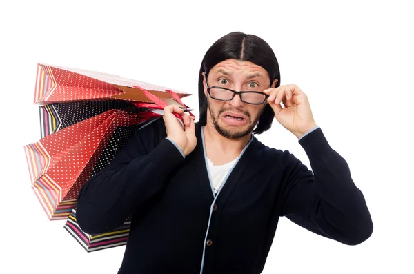 Jeune homme tenant des sacs en plastique isolés sur blanc — Photo