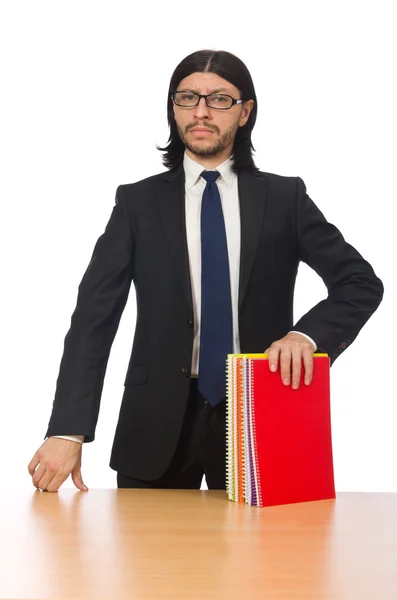 Joven empresario sosteniendo libros aislados en blanco —  Fotos de Stock