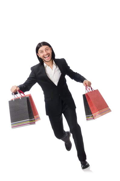 Traje negro hombre sosteniendo bolsas de plástico aisladas en blanco — Foto de Stock