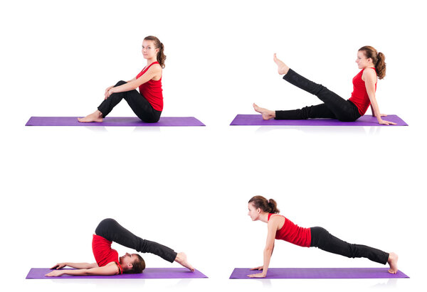 Young female doing exercises on white