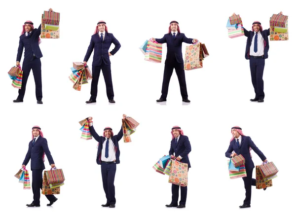 Hombre árabe con regalos de compras en blanco —  Fotos de Stock