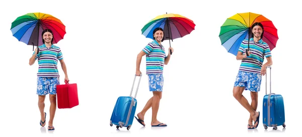 Reiziger met rode koffer en paraplu geïsoleerd op wit — Stockfoto