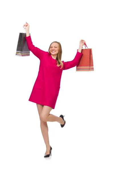 在粉红色的连衣裙，拿着塑料袋购物女孩 — 图库照片