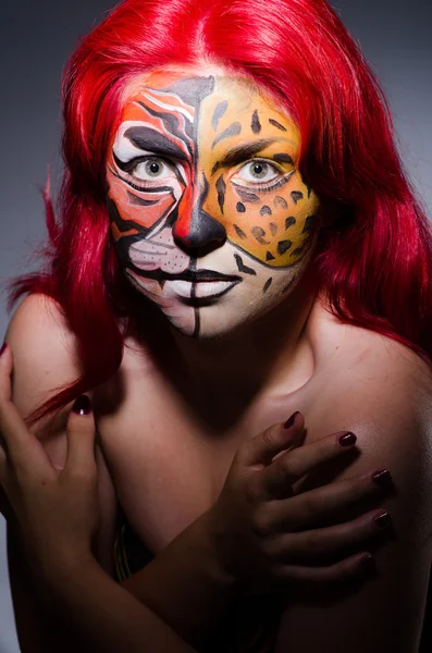 Woman with tiger face in halloween concept — Stock Photo, Image