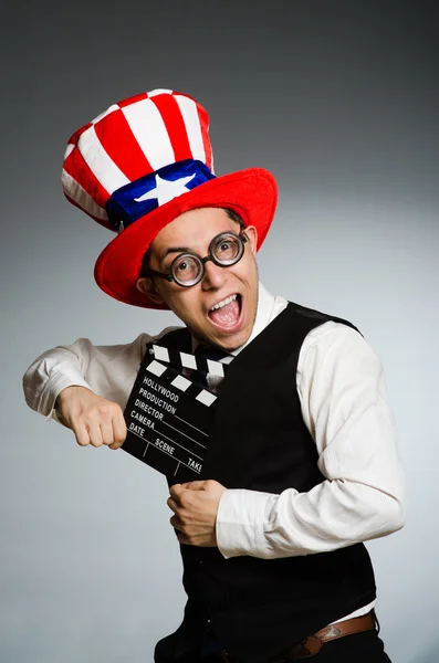 Man with american hat and movie board — Stock Photo, Image