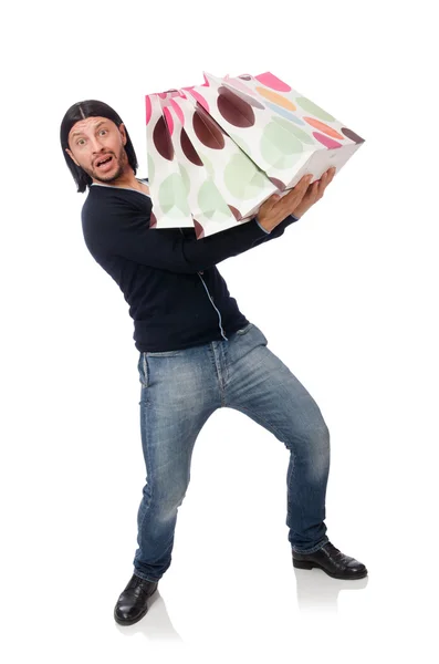 Giovane uomo in possesso di sacchetti di plastica isolati su bianco — Foto Stock