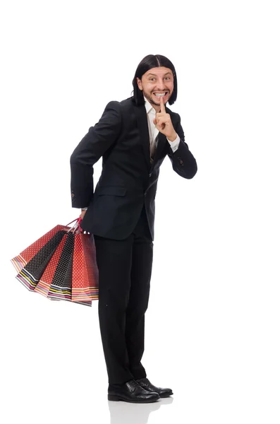 Black suit man holding plastic bags isolated on white — Stock Photo, Image
