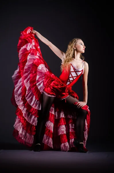 Young woman dancing in red dress — Stock Photo, Image