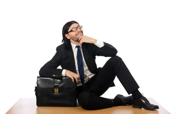 Молодий бізнесмен сидить на підлозі ізольовано на білому — стокове фото