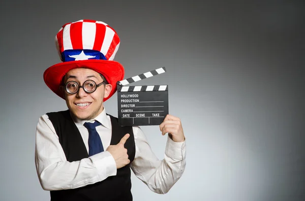 Człowiek z american board kapelusz i film — Zdjęcie stockowe