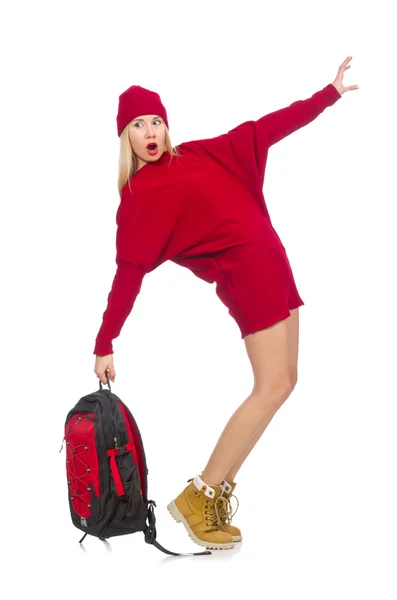 Pretty girl in red dress and backpack isolated on white — Stock Photo, Image