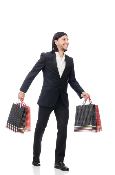 Preto terno homem segurando sacos de plástico isolado no branco — Fotografia de Stock